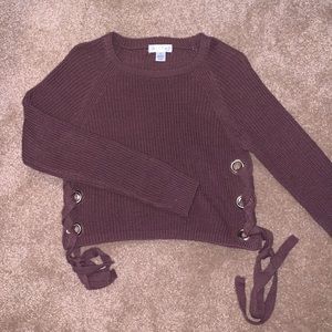 Knit sweater w/ ring holes and cross tie on sides